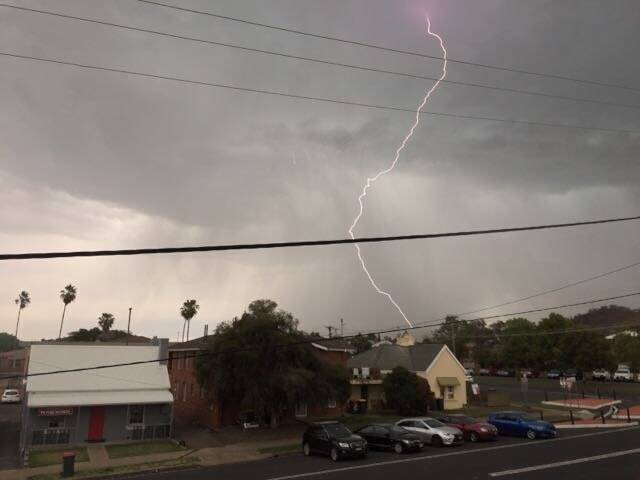 Incoming: A bolt of lightning strikes North Tamworth on Wednesday as a storm cell rolled across the region dropping over 14 mm of rain on Tamworth Photo: Madeline Link
