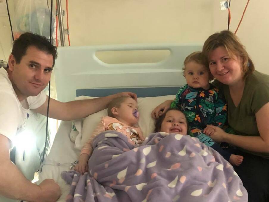 Brave fight: Barry, Chloe, Lexi, Noah and Shiralee Coss spending some treasured time together as a family at John Hunter Hospital. Chloe lost her fight on Monday evening.