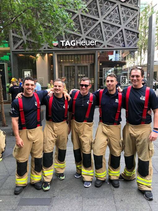 To the top: Team Tamworth preparing to step up at the Firies Climb for MND event.