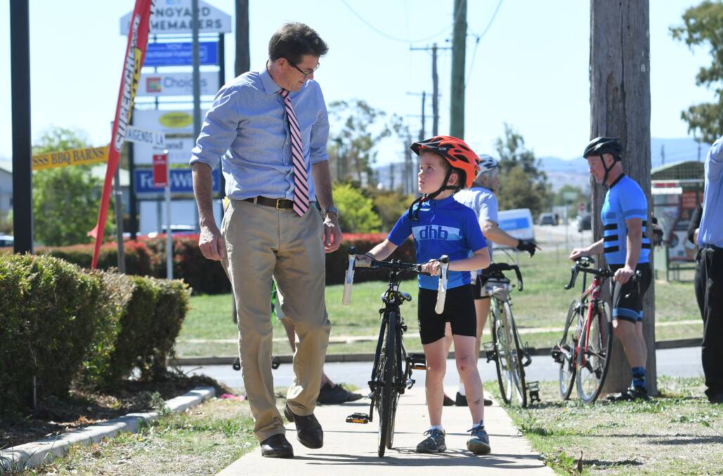 Safety first: Kevin Anderson has a chat to eight year old Toby Wright on the site of the new stretch of shared pathway on Goonoo Goonoo Road. Photo: Gareth Gardner