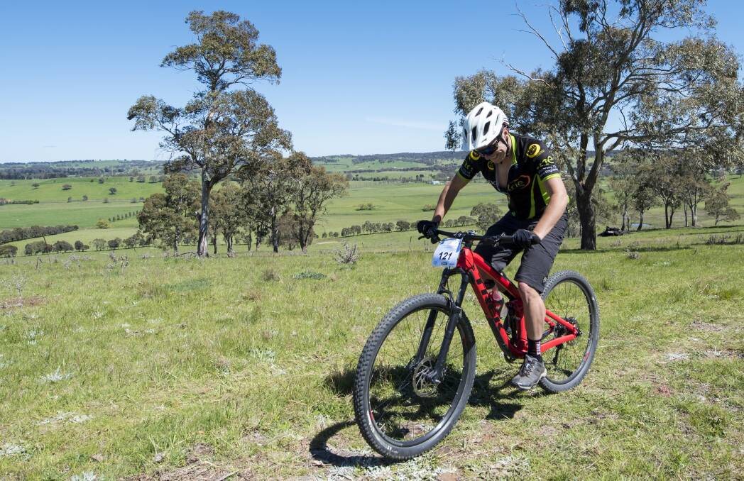 Ride with a view: Carl Hooton pumps the legs around the picturesque 14km Walcha Mountain Bike Challenge course on Sunday. Photo: Peter Hardin 161016PH