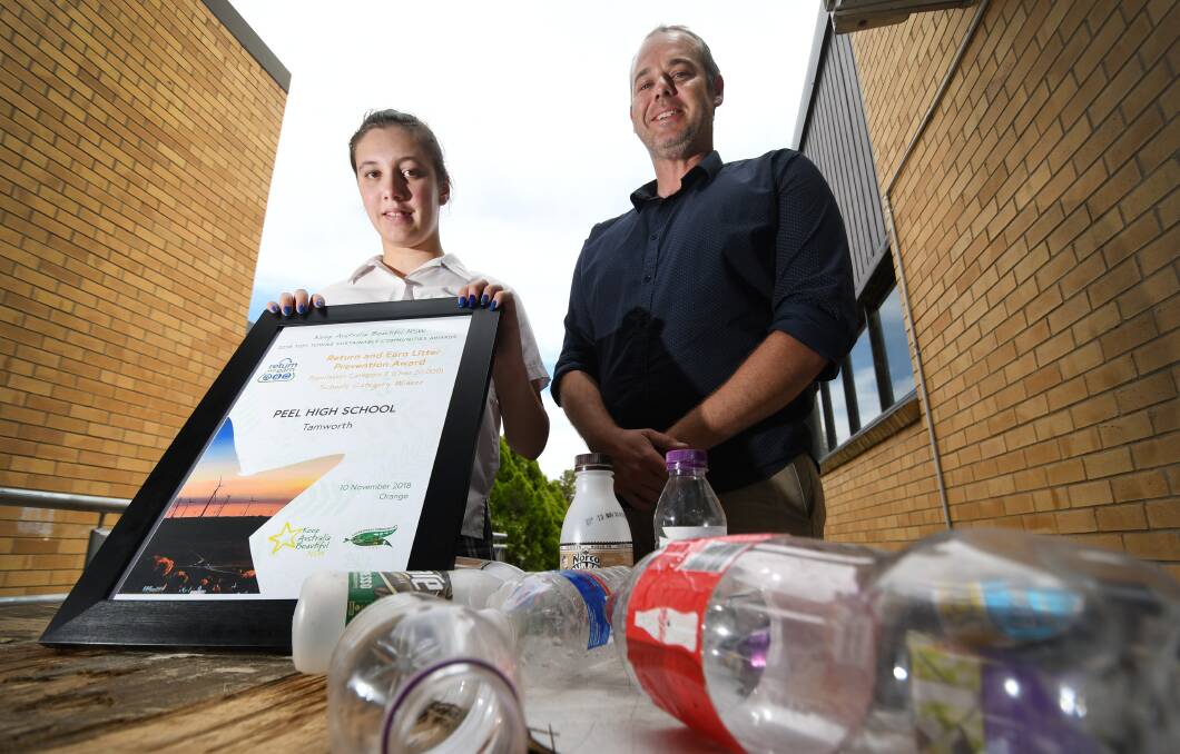 Container excitement: Student Bella Rose-Follington and Support teacher Chris Hadden with the Sustainability Award received for their recycling program.  Photo: Gareth Gardner