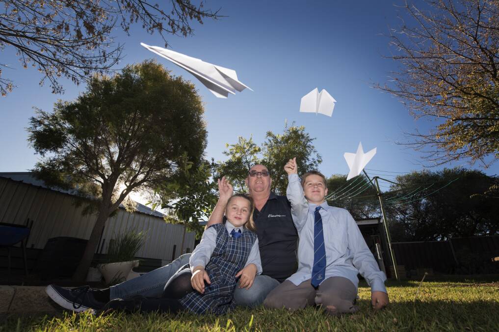 Plane parenting: Paul Briscoe, with his grandchildren Fathering Project Zahlia and Tayten Gall, is bringing the Fathering project to the Tamworth region. Photo: Peter Hardin 240719PHF033
