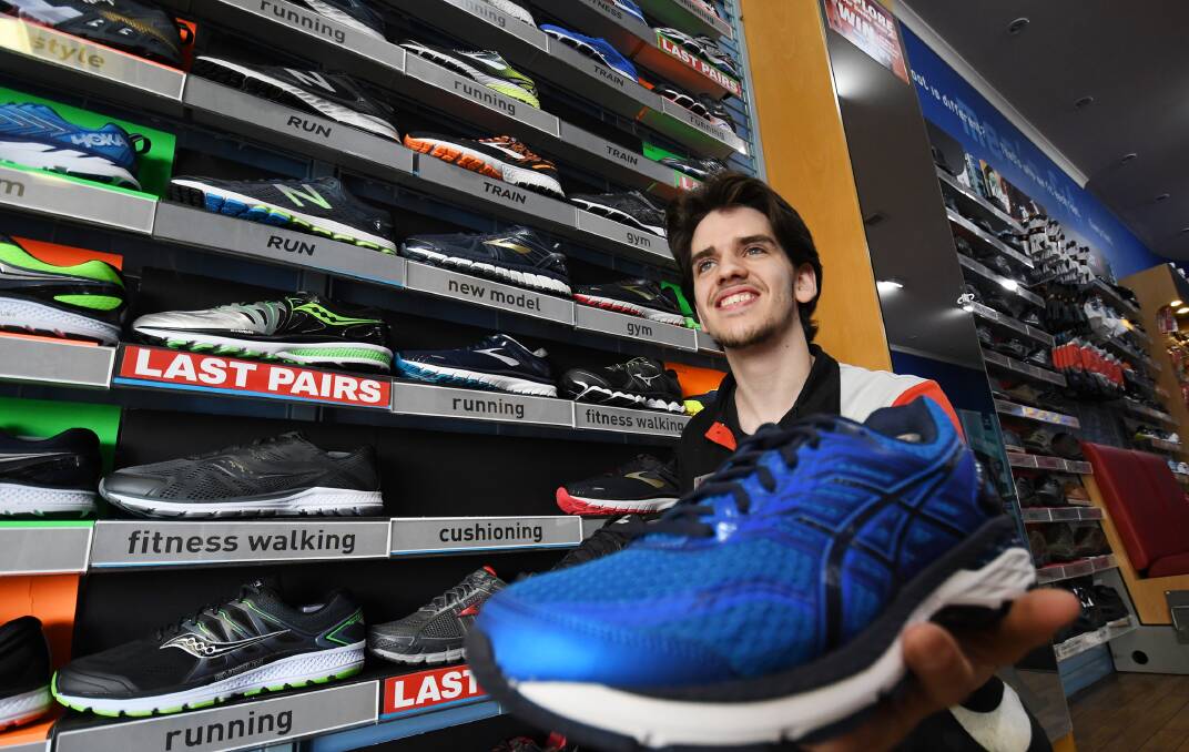 If the shoe fits: Ethan Latsinos has been nominated several times for his outstanding customer service at the Athlete's Foot. Photo: Gareth Gardner