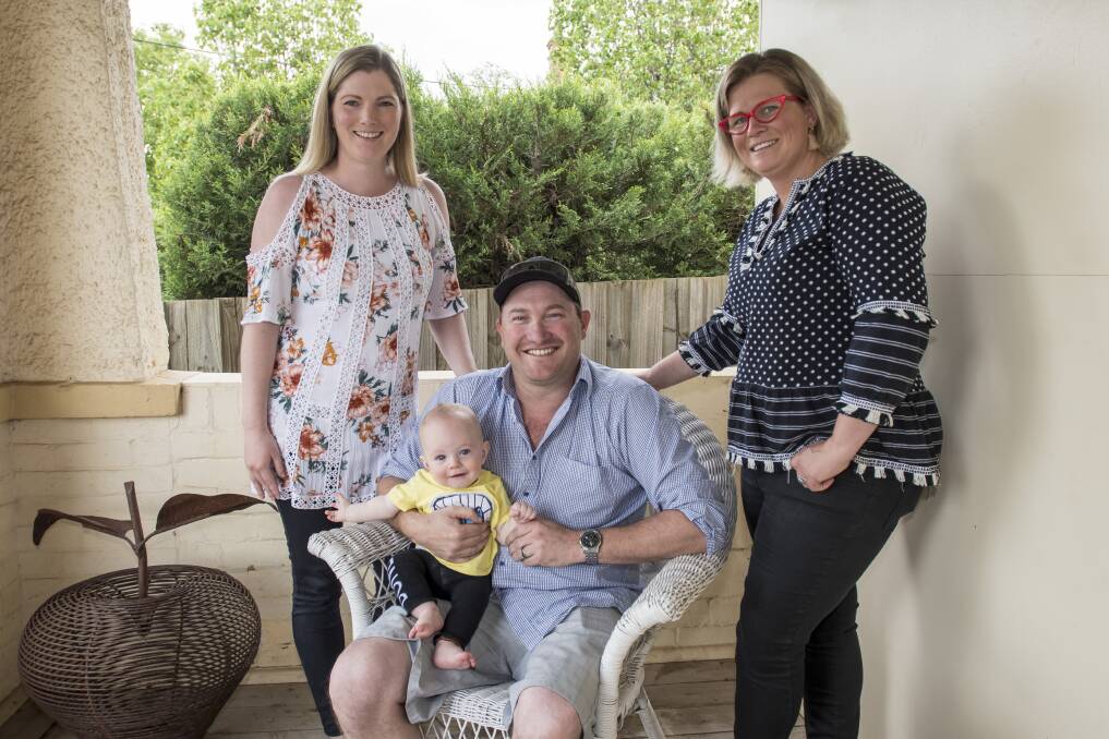 Sleeping like a baby: New parents Shanna and Troy Brinkley are having a kuch easier time getting baby Hudson to sleep after just one session at Kate Ross's new business Sleep Effect. Photo: Peter Hardin 