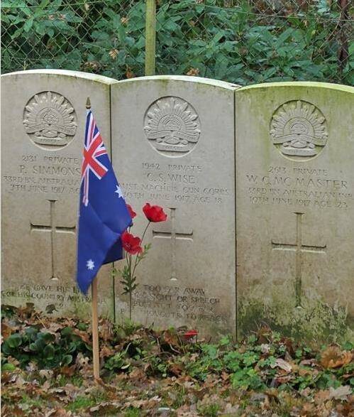 Brothers in arms: Cecil Wise's grave with a flag and poppys placed by a Belgium man who has 'adopted' the grave.
