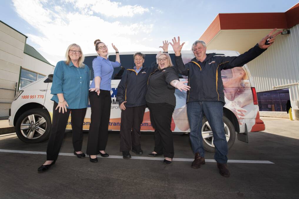 High five: The team at Oxley Community Transport have been named a finalist in a record five business award categories, as well as the Leader's People's Choice. Photo: Peter Hardin 220719