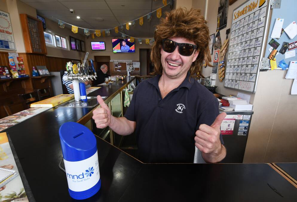 Feral Fonz: Kooty Hotel publican Andrew Yeo is letting the back locks flow in the Mullets for MND challenge. Photo: Gareth Gardner
