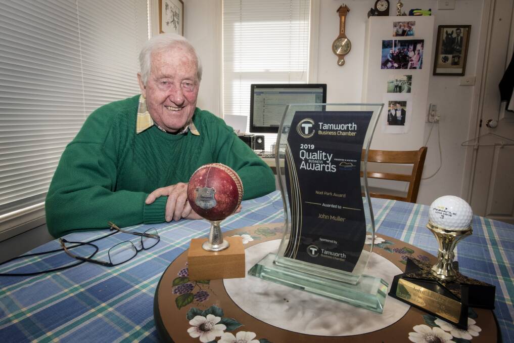 On the ball: John Muller OAM was honoured to pick up the Noel Park Award, which proudly sits between the cricket ball he took 10-22 with, and the golf ball he sunk for a hole-in-one. Photo: Peter Hardin