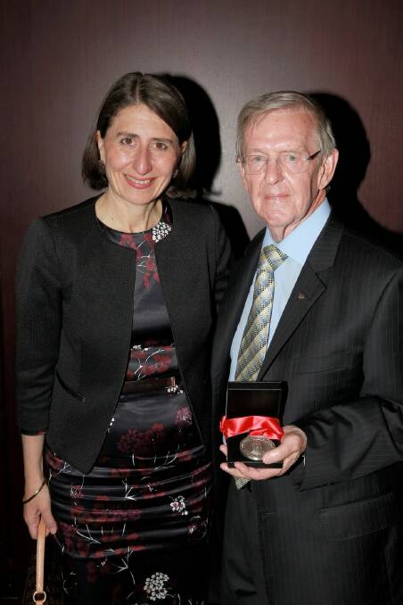Top drop: Premier Gladys Berejiklian and Tamworth hotelier Bevan Douglas after the publican was inducted into the AHA Hall of Fame on Tuesday. 