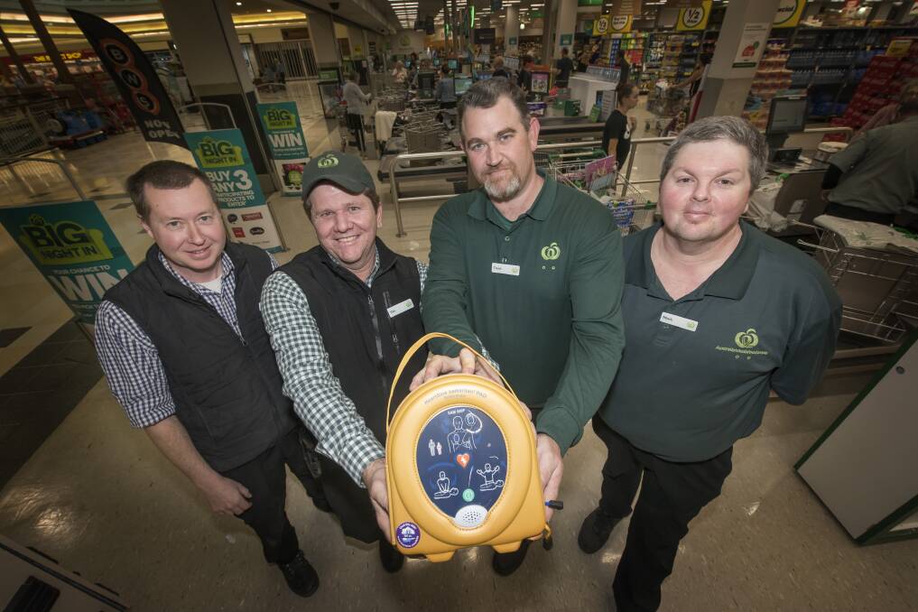 Heart starter: Woolworth's staff members Brett Rushby, Tim Kelly, Trent Ashen and Mark Woolfe with the Tamworth stores newly installed life-saving AED. Photo: Peter Hardin 030719PHE011