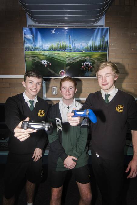 Playstation education: Joe Mutch, Brock Peters and Joshua Cripps are off to the eSports National School Championships in Adelaide. Photo: Peter Hardin
