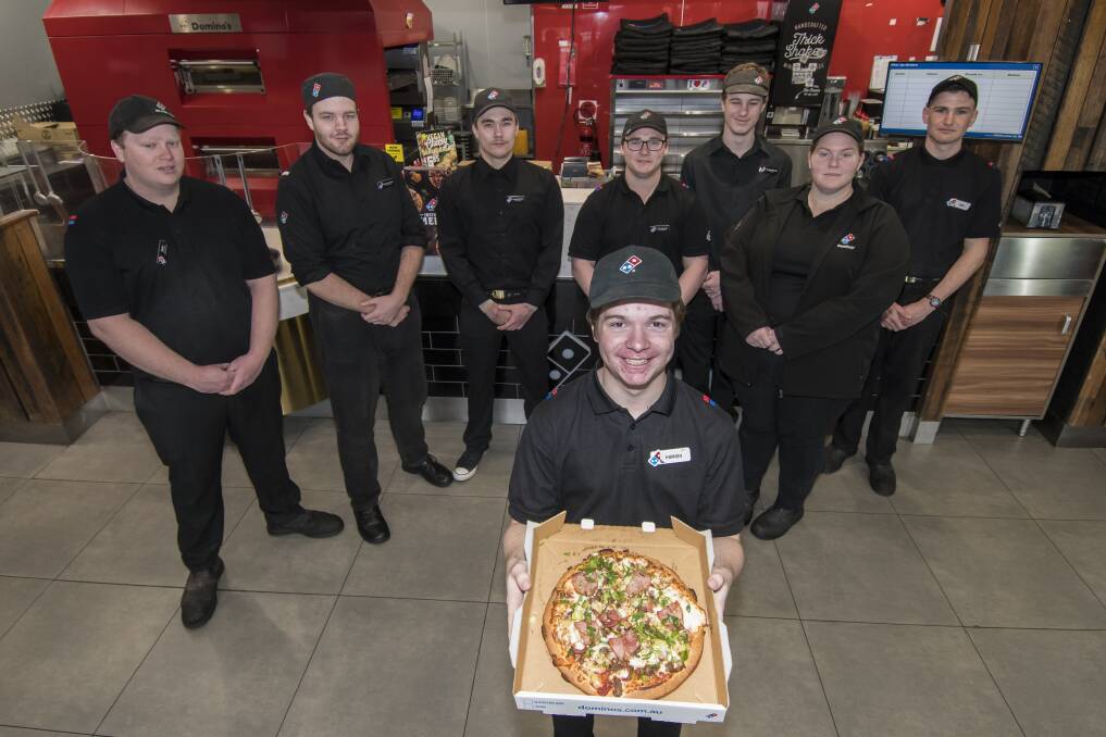 Guilt free pizza: Hamash McAdams and the Dominoes team are giving 50 cents from every pizza sold on Wednesday to Rural Aid. Photo: Peter Hardin
