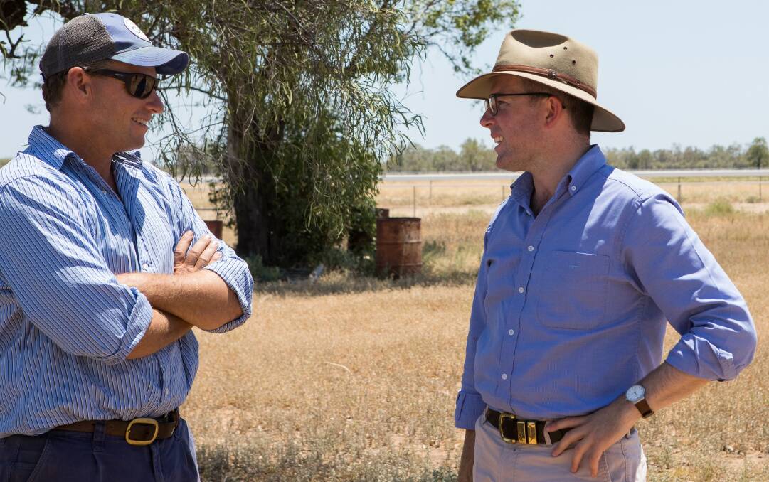 NSW Minister for Agriculture Minister Adam Marshall speaking to a farmer in western NSW about native vegetation laws. Photo: Supplied