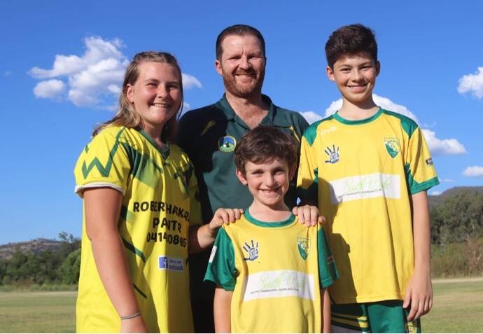 FUNDING: Souths United Football Club president Mark Ross with Georgia Smith, Will Allomes and Ethan Ross. Photo: Supplied