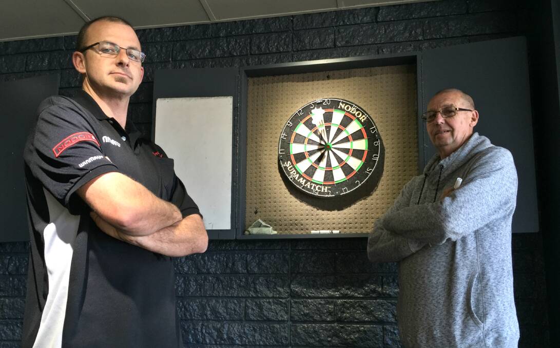 LOCAL CHARGE: Andrew and Tom Bowden will go up against state and Australia representative players at the Tamworth Games Dart Tournament. Photo: Ben Jaffrey