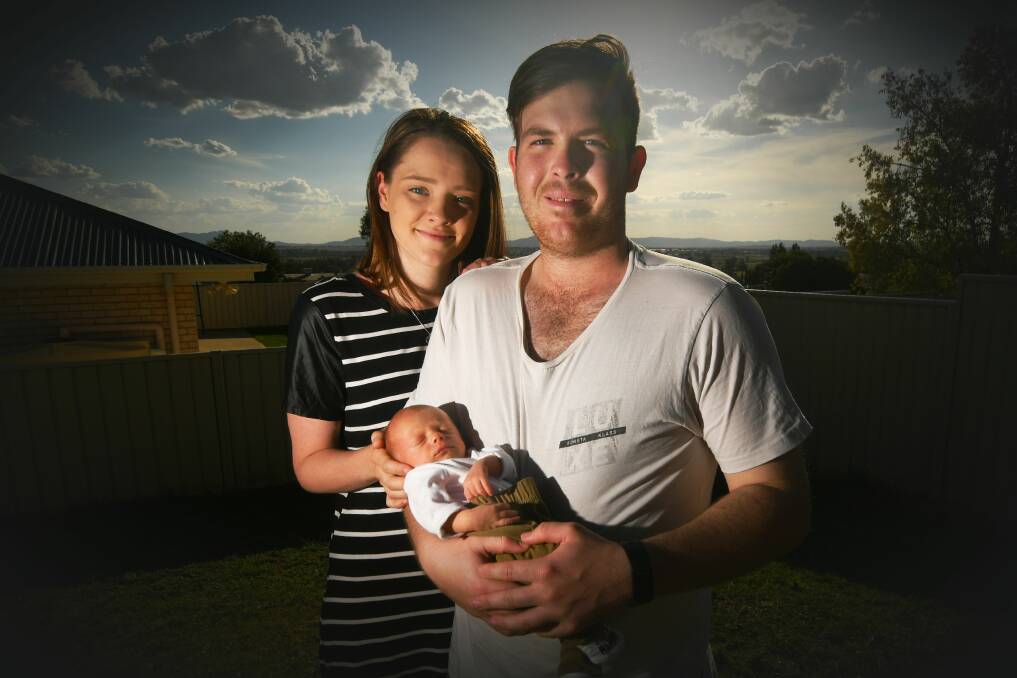 FAMILY TIME: Brock Ridgewell with partner Stacey Jones and their two-week-old son, Charlie. Photo: Gareth Gardner