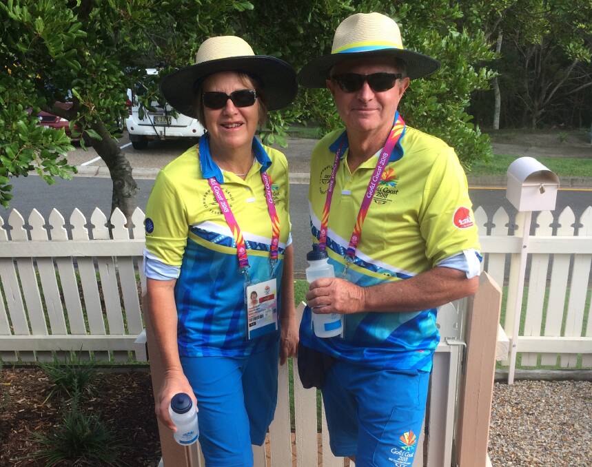 READY TO GO: Prue and Mark Kesby in their volunteer kit for the Commonwealth Games. Photo: Supplied