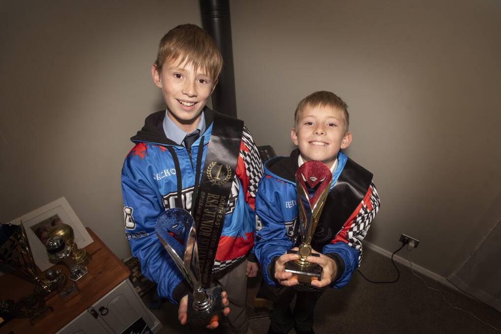 CAPPING OFF A BIG SEASON: Jackson and Benji Gordon with the trophies they won South East Queensland Junior Championship. Photo: Peter Hardin