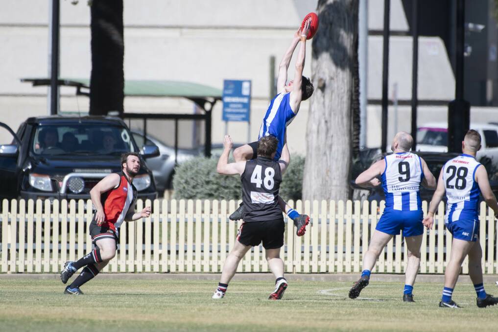 LEAP: Jack Dadd flies high for the Kangaroos during the year. He is one of several AFL North West players in the Northern Heat squad. Photo: Peter Hardin