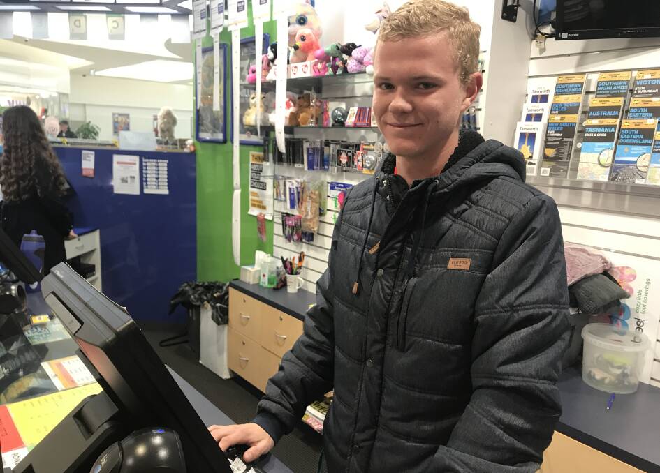 RISING UP THE RANKS: Ryan Schmiedel working at Shoppingworld Newsagency after making his first grade refereeing debut on Sunday. Photo: Supplied