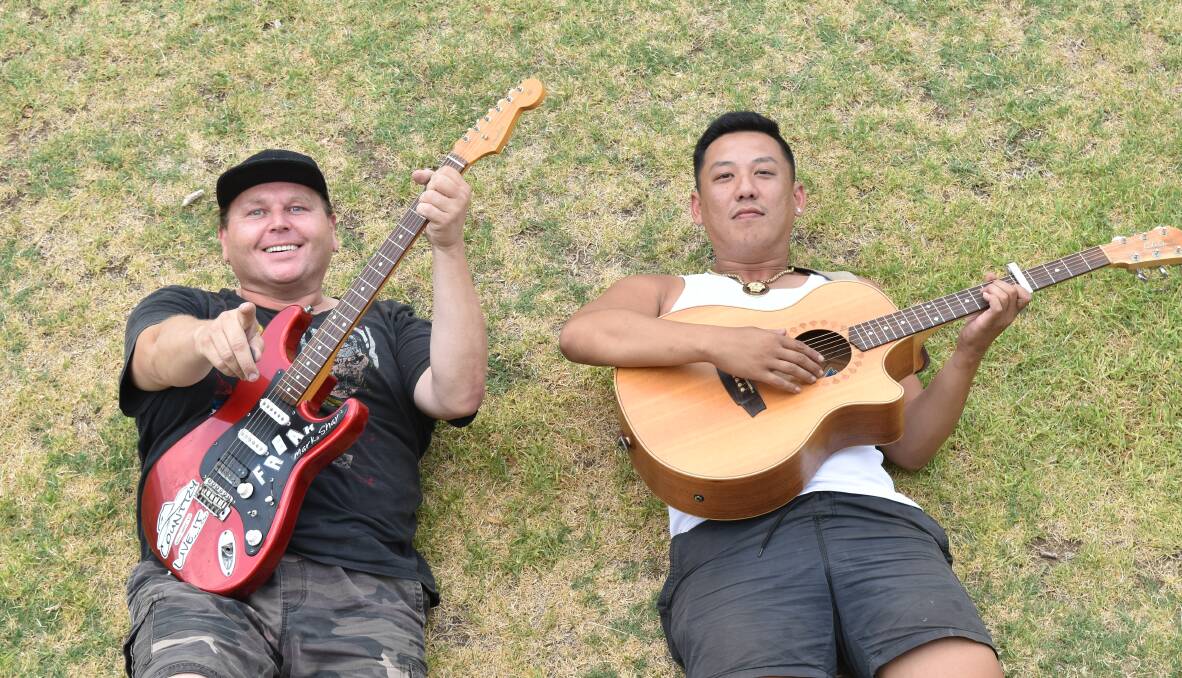 POSITIVE: Mark Shay and Andy Nguyen are still having a good time at the Riverside campgrounds. Photo: Ben Jaffrey