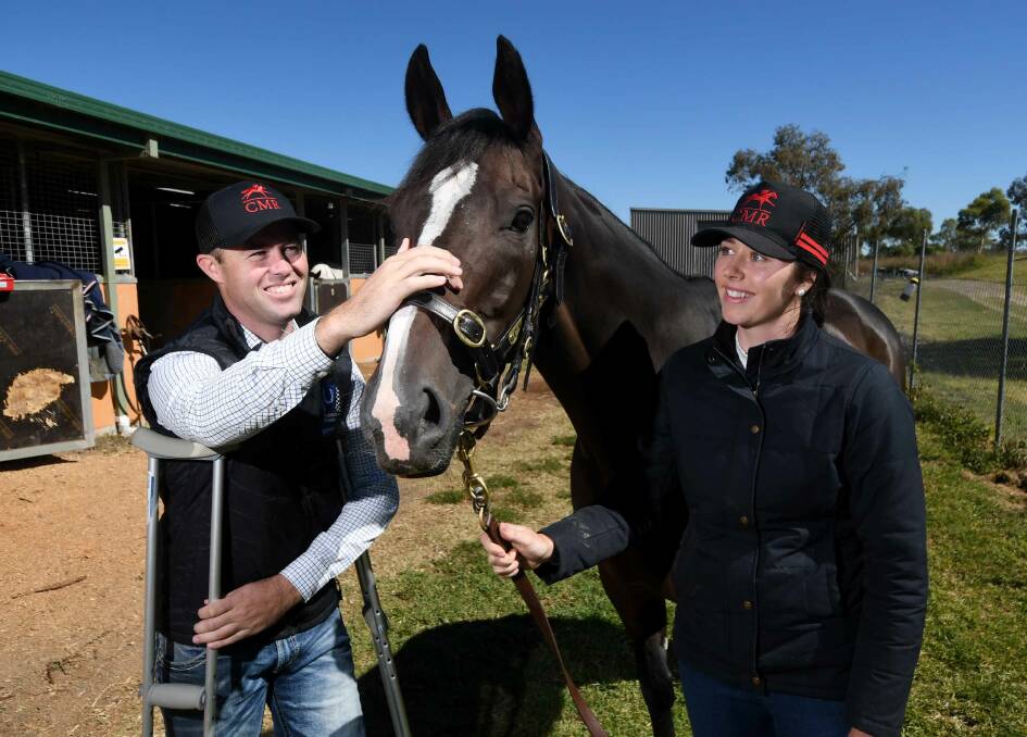 BIG RACE: Cody Morgan and his partner Lucy Goodsell with Wren's Day at their stables. Photo: Gareth Gardner
