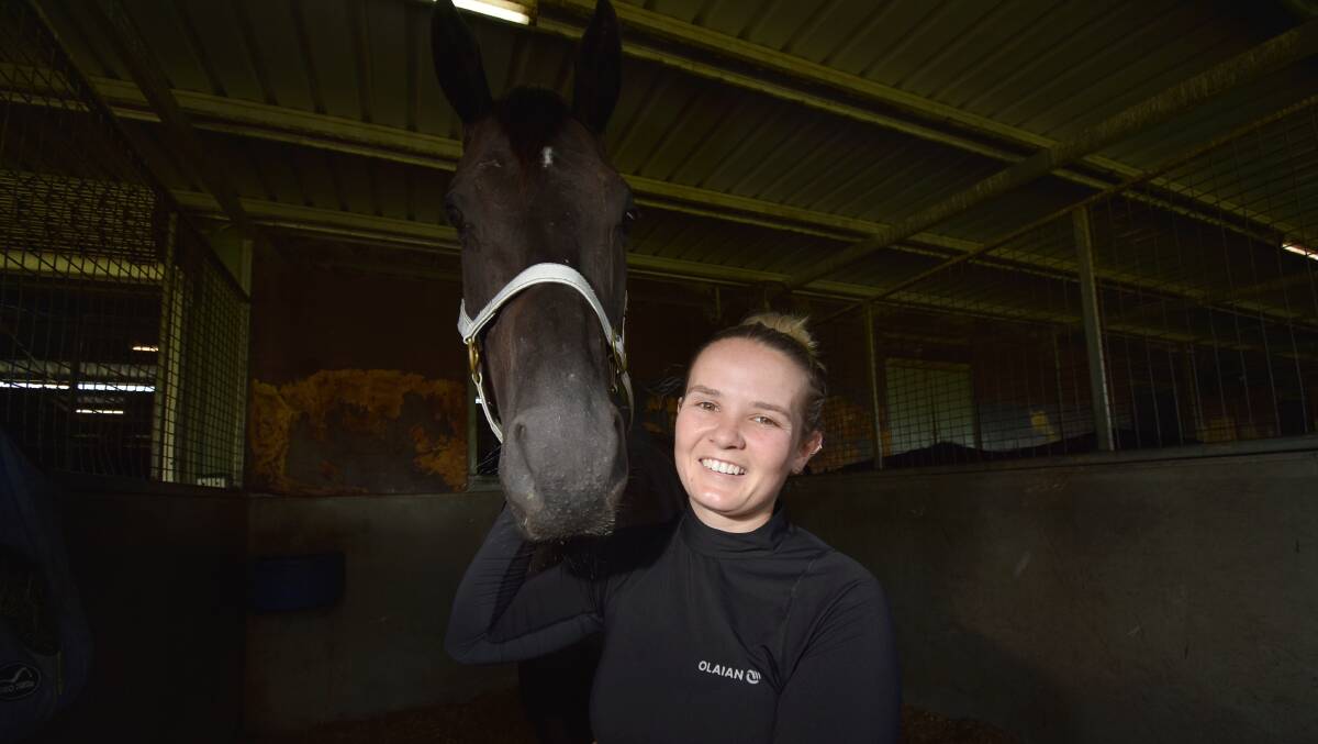 SETTLED IN: Casey Waddell with Moyassar at the Cody Morgan Racing Stable in Tamworth. Photo: Ben Jaffrey