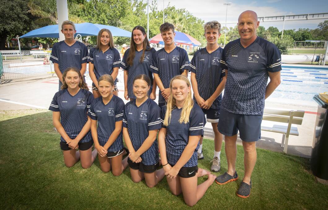 TRAINING HARD: TCSC coach Nicolas Monet with some of the club's swimmers that will head to Homebush this week. Photo: Peter Hardin