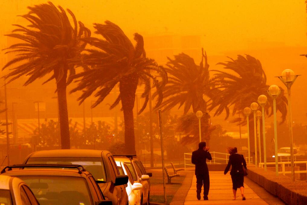 Click the photo to see photos of the 2009 dust storm that hit NSW. Picture: Kitty Hill