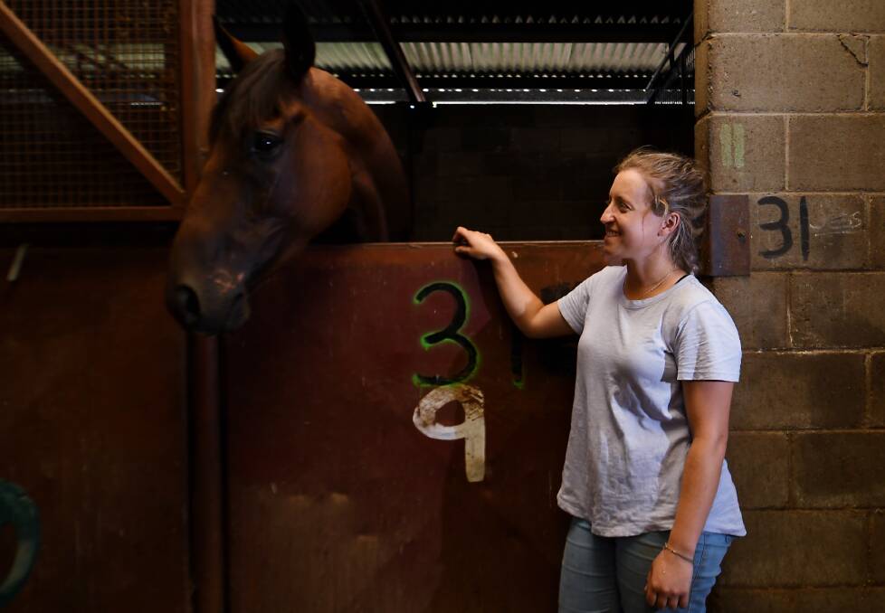 HOME: Mel Bolwell with Jonesy back at the stables on Wednesday. Photo: Gareth Gardner