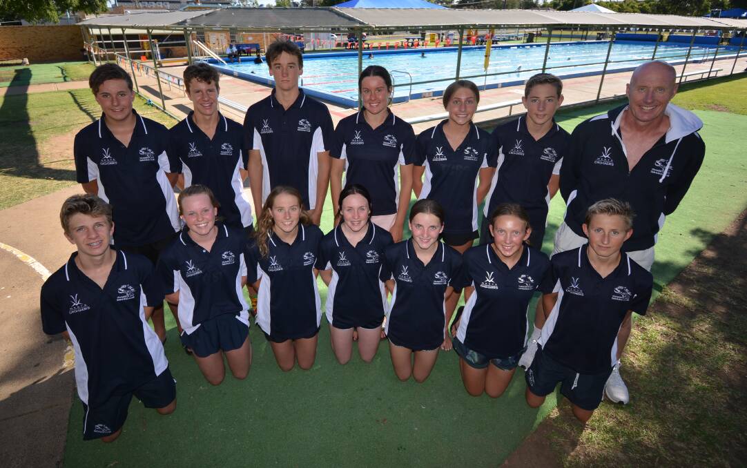 READY TO GO: Tamworth City Swimming Club coach Nicholas Monet with his swimmers before they go to the Senior State Age Championships.