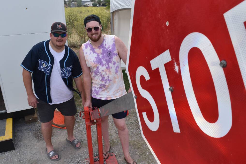 STOP: Jeremy Bird and Brad Smith of Armidale Outlaws Baseball man the gate at the Riverside campgrounds. Photo: Ben Jaffrey