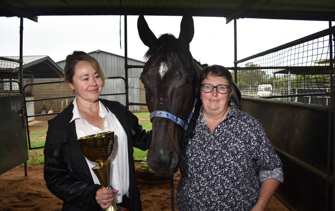 THREEPEAT: Owner Suzy Cleland, left, and trainer Theresa Stair with Belbaroo after winning the Diggers Cup. Photo: Ben Jaffrey
