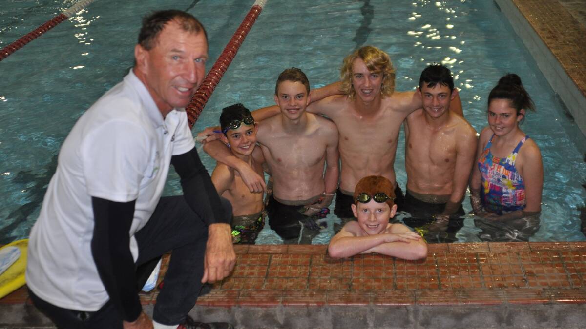 EXPERIENCE: John Hickey, pictured with Jed Rennick, Andre Steele, Logan Dries, Kurt Rennick, Brooke Rennick and Angus Hobson (front), coaches in a range of sports including swimming.