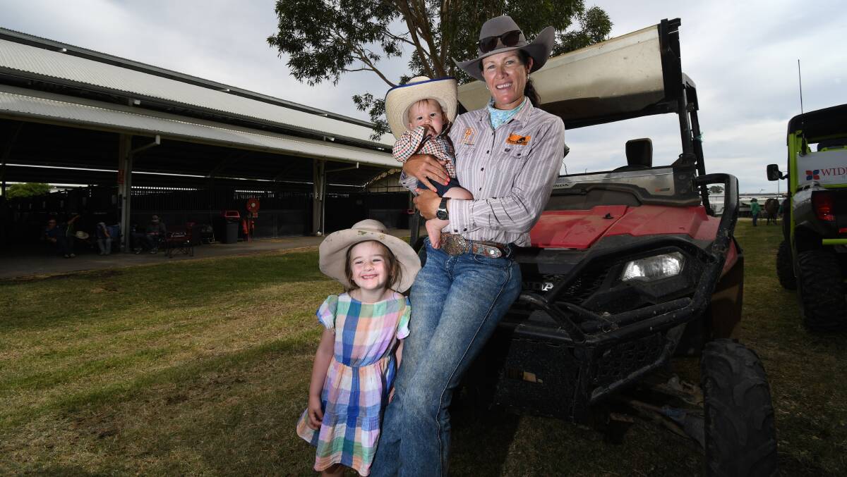 Emma Webb with children Lucy, 4, and Bryce, eight months, at the Nutrien Classic Campdraft and Sale. Picture by Ben Jaffrey