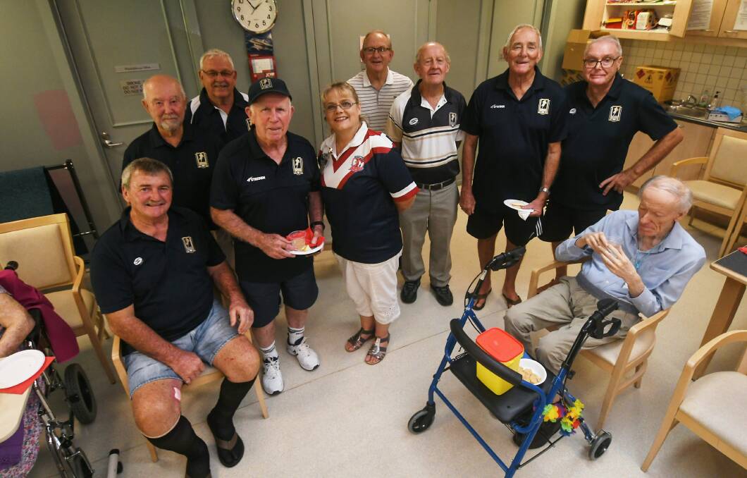 Men of League members with Nazareth House wellbeing and lifestyle manager Leanda Greacen who organises the tipping competition. Photo: Gareth Gardner
