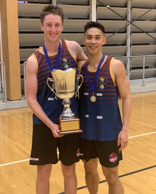 BIG MOMENT: Brody Blackett-Gregg with teammate Eugene Lee after winning the division one M League title with the Sydney Uni Varsity Griffins. Photo: Supplied