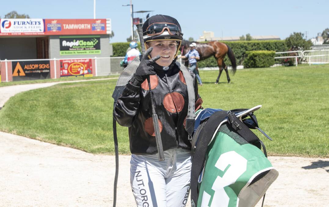 TREBLE: Casey Waddell celebrates after claiming her second of three wins at the Tamworth Jockey Club on Tuesday. Photo: Peter Hardin