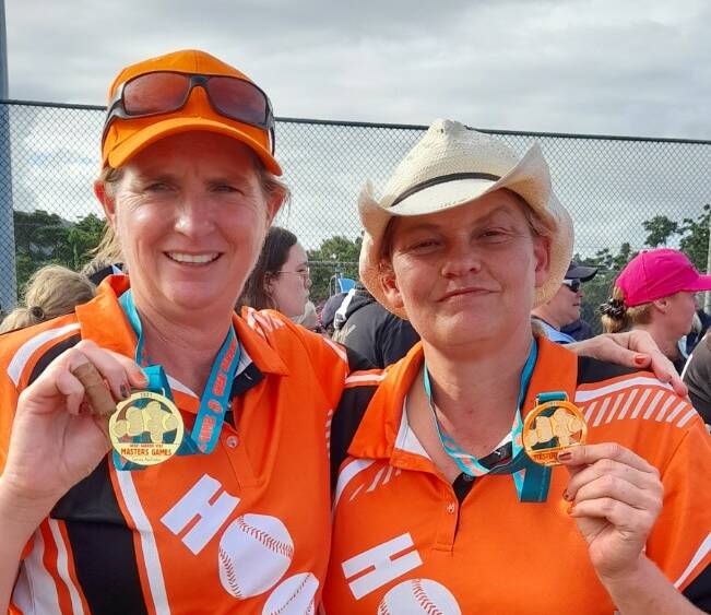 GOLD RUSH: Natalie Crittle and Leannda Green show off their gold medals from the Great Barrier Reef Masters Games. Photo: Supplied