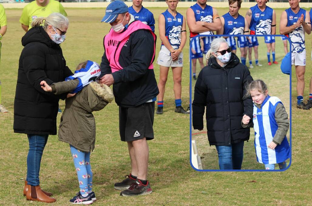 SPECIAL: Tony Bishop and Kristy help put Asta's new jersey on before, inset, mother and daughter leave the field before the game. Photos: Sarah Dadd