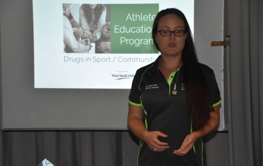 PARTNERSHIP: UNE lecturer Dr Cloe Cummins presenting to NIAS athletes at the “Your local club” GROWTH day. Photo: Supplied