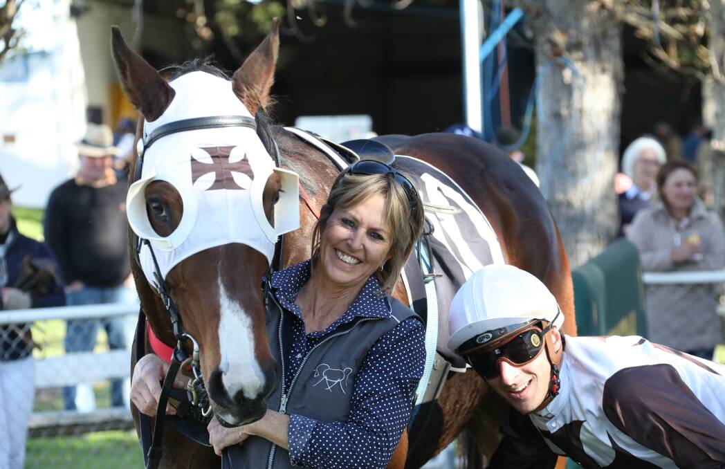 RETURN TRIP: Michelle Fleming, pictured with jockey Alexandre Lemarie and St Luke, will be heading to Muswellbrook on Melbourne Cup day. Photo: Bradley Photos