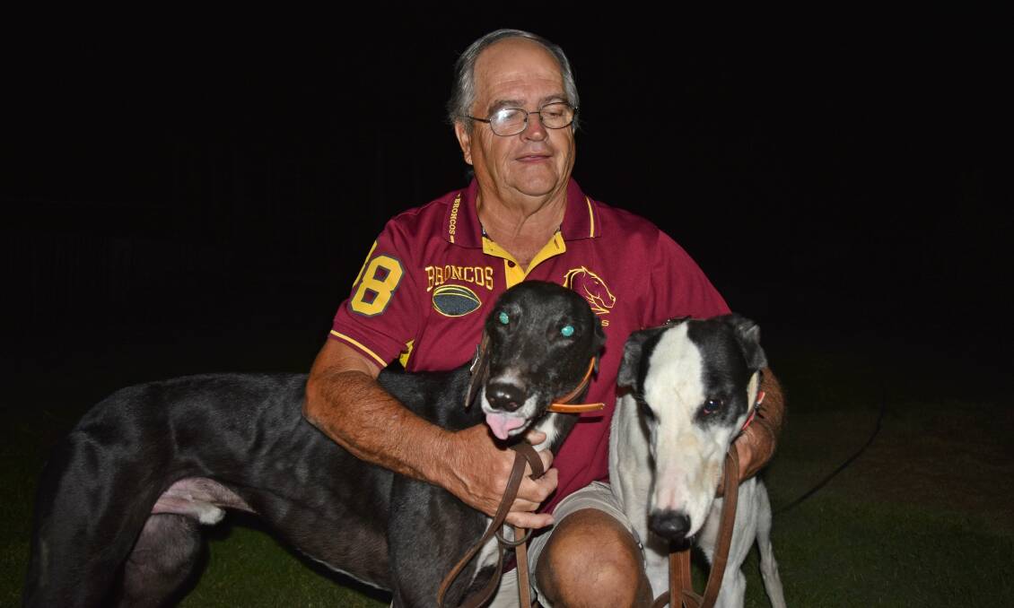 TWO BITES AT THE CHERRY: Peter Midson with Mr Deeks and Armatree Boy at his property. Midson will have four greyhounds in total go around at Tamworth. Photo: Ben Jaffrey
