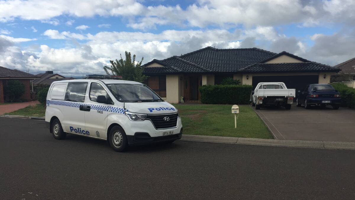 Investigations continue: Emergency services were called to a house on Merrinee Place in Hillvue about 9pm following reports of a domestic-related incident. Photo: Peter Hardin
