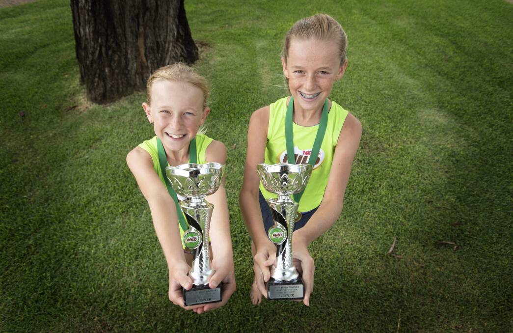 BIG EFFORT: Lylah and Liette Tindall had a weekend to remember when they competed at the Nestle Junior Triathlon. Photo: Peter Hardin