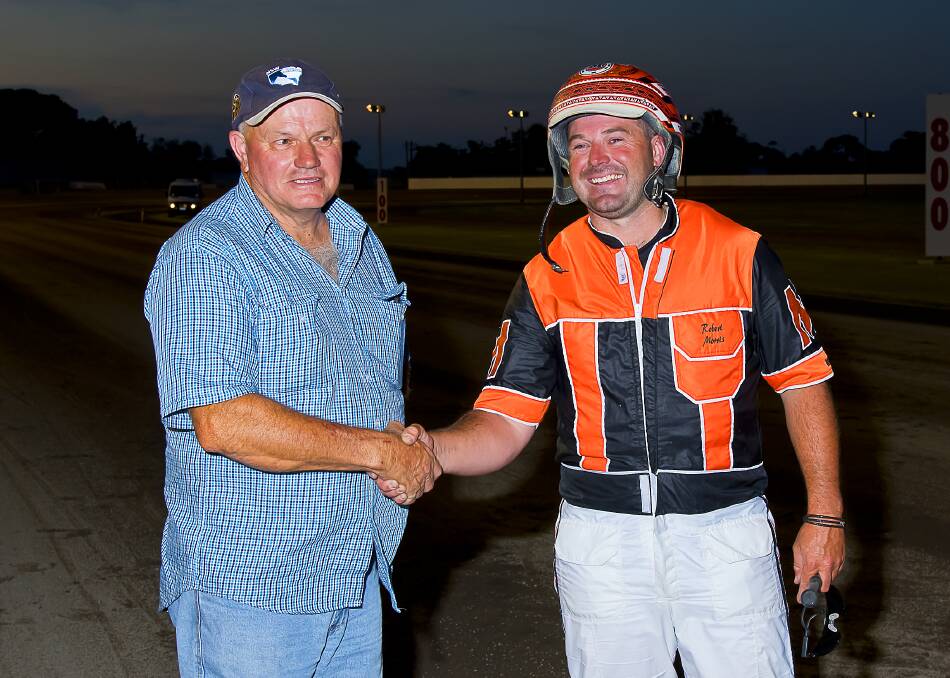 WINNING COMBO: Trainer Geoff Harding congratulating reinsman Robbie Morris after taking out the Golden Guitar Final. Photo: PeterMac Photography