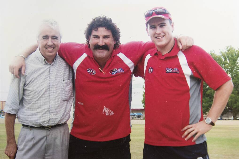 ABOVE: Gerry and Evan Griffiths with Robert 'Dipper' DiPierdomenico. Through AFL, the Griffiths have had the chance to meet the likes of Ron Barassi, Warwick Capper, Mark Jacko Jackson, Darren Bewick, Matty Nicks, Ray Chamberlain and Michael O'Loughlin. Photo: Supplied