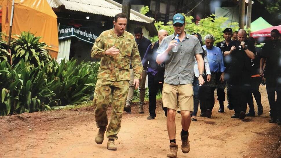 HEROIC: Major Alex Rubin briefs Dr Richard Harris on arrival at the Thumluang Cave rescue site.