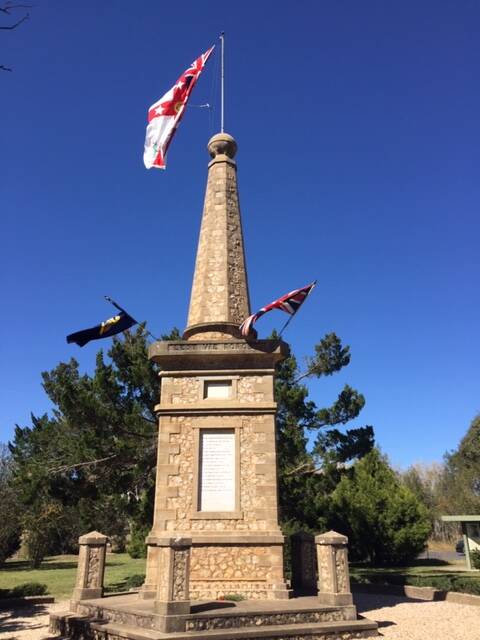 WE REMEMBER: Flags were flying at the Dangarsleigh War Memorial on Friday, where a Anzac Day service was recorded to be uploaded to YouTube.